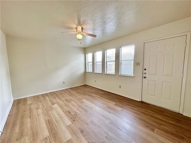 Foyer featuring ceiling fan, light hardwood / wood