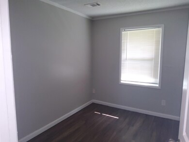 Spare room with wood-type flooring
