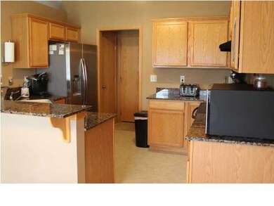 Kitchen with main floor laundry room from garage