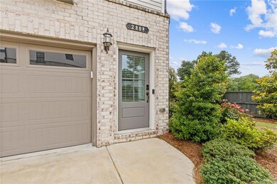 Entrance to property featuring concrete driveway