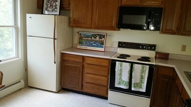Modern kitchen with open window to...