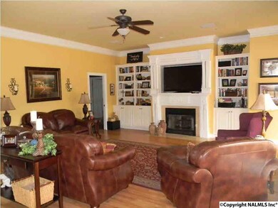 LIVING ROOM FEATURES BUILT IN BOOKCASE, GAS LOG FIREPLACE. SMOOTH 10 FOOT CEILINGS LOTS OF CROWN MOLDING