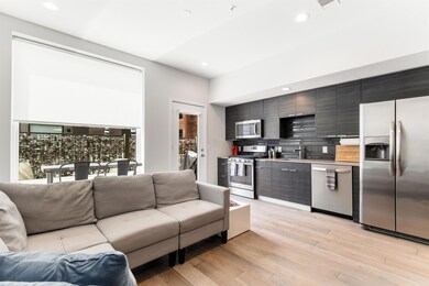 Living room with light wood-style floors and rece