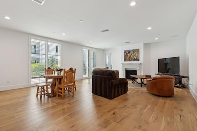 Living room featuring light hardwood / wood-style 
