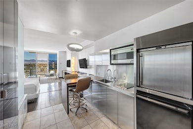 Kitchen featuring modern cabinets, stainless steel