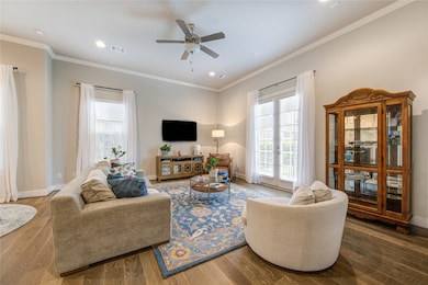 Bright and open living area featuring 11’ ceilings