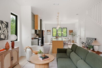 Living area featuring light wood-style floors, st