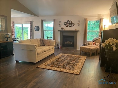 Living Room with Gas Fireplace & Vaulted Ceiling