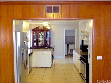 View of open, airy and spacious kitchen from dinin