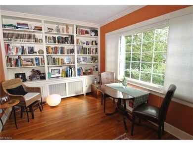 A wall of bookcases and large picture window are f