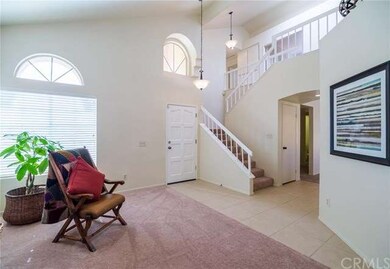 View from living room of beautiful open stairway.