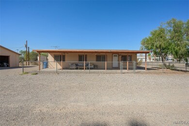 View of front of property featuring an outbuilding