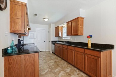 Renovated Kitchen offers slab granite counters and