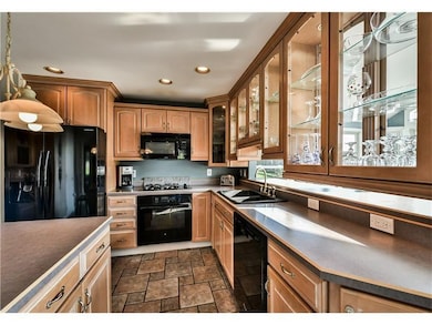LARGE KITCHEN WITH ABUNDANT CABINETS, INCLUDING TH