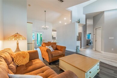 Livingroom, open to dining room with access to poo