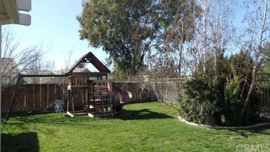 Backyard. Note great swingset!