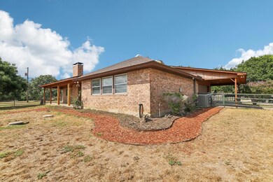 View of side of property with central AC
