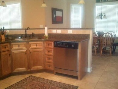 Fantastic Kitchen has granite countertops with til