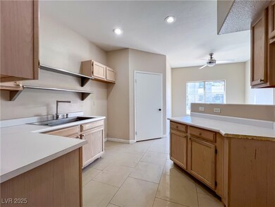 Kitchen with light tile patterned floors, recessed