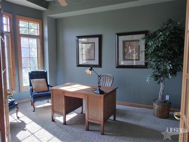Den with French doors & new carpet