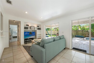 ANOTHER VIEW AND DECOR OF FAMILY SITTING AREA AND ENTRANCE TO 3RD BEDROOM