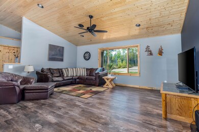 Living room featuring wooden ceiling, vaulted ceil