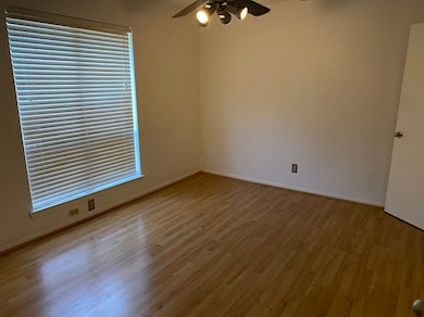 Spare room with ceiling fan and wood finished floors