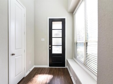 Modern custom front door, to the left is the downs