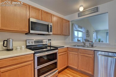 Kitchen featuring metal racks in dishwasher, micro