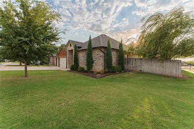 Property exterior at dusk with a yard and a garage