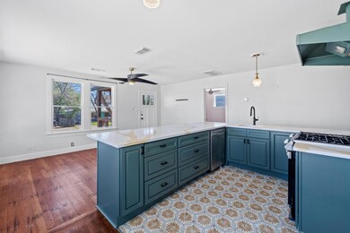 Kitchen with visible vents, appliances with stain