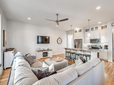 Living room featuring light hardwood / wood-style 