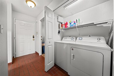 Laundry room featuring washing machine and clothe