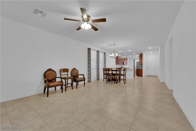 Living area featuring visible vents, recessed ligh