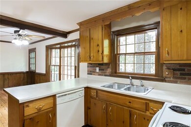Abundant counterspace and cabinetry in this sunny 