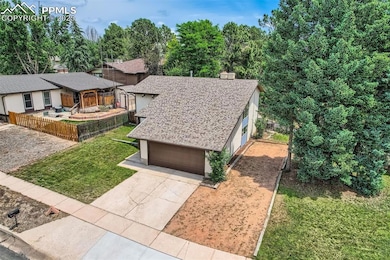 View of front showing garage, front and side yards