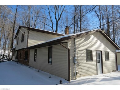 This home is nestled into the woods for complete p