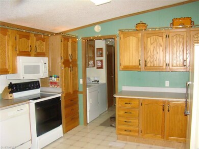 Kitchen is open to laundry area and side entry doo