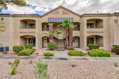 Mediterranean / spanish home featuring stairway, stucco siding, and a tiled roof