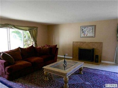 Large formal living room with travertine wood-burn
