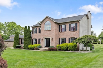 Mature landscaping creates stunning curb appeal.