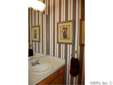 Bathroom. There is a half bath in the foyer along 