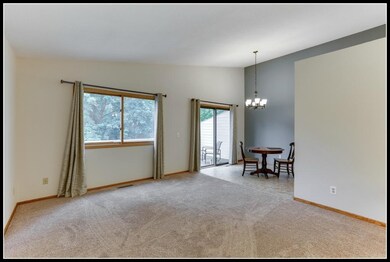 Upper level living room looks out to backyard