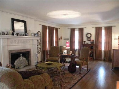 Spacious formal living room with plenty of windows