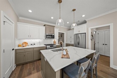 Haven Model across the street - Quartz Countertops, SS Appliances, & Gas Cooktop