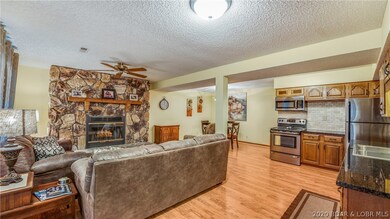 Lower level living area with wood burning fireplac