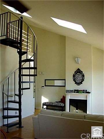 This home features vaulted ceilings with an abunda
