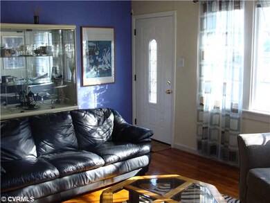 Living Room - Painted accent wall and view of lead glass front door
