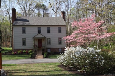 The mature landscaping includes the blooming of se