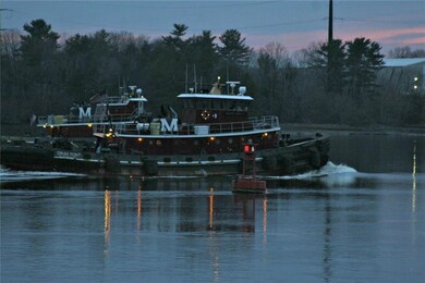 Moran tugs racing up river to...